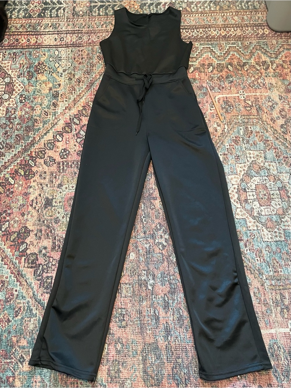 Sleeveless Black Jumpsuit with Drawstring Waist, Front Pockets, and Keyhole Back